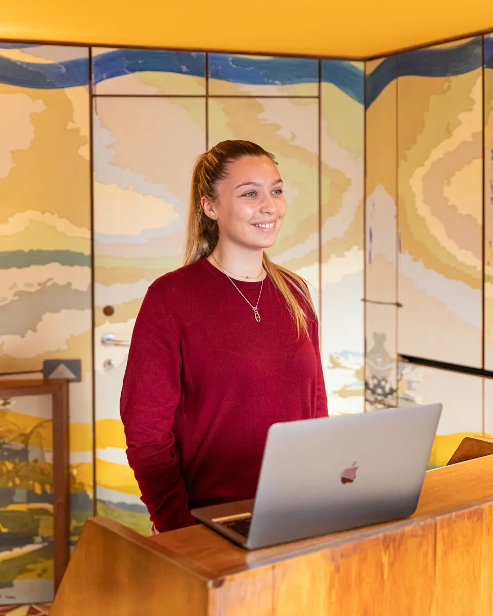 Receptionist welcoming guests at the frontdesk
