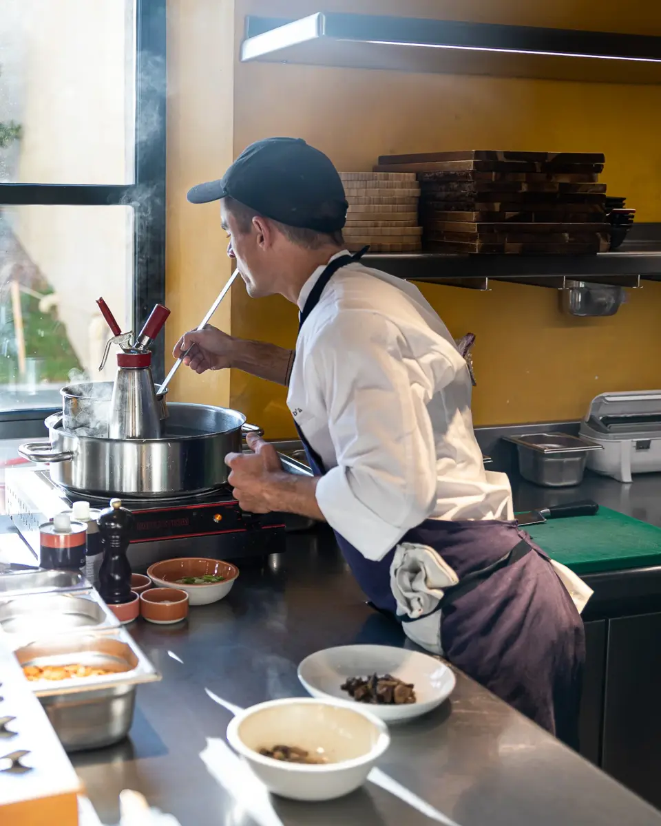 A cook is preparing a dish